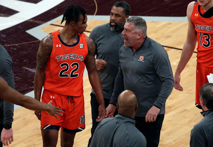 Mar 2, 2022; Starkville, Mississippi, USA; Auburn Tigers head coach Bruce Pearl (right) talks with guard Allen Flanigan (22) during the first half again the Mississippi State Bulldogs at Humphrey Coliseum. Mandatory Credit: Petre Thomas-USA TODAY Sports